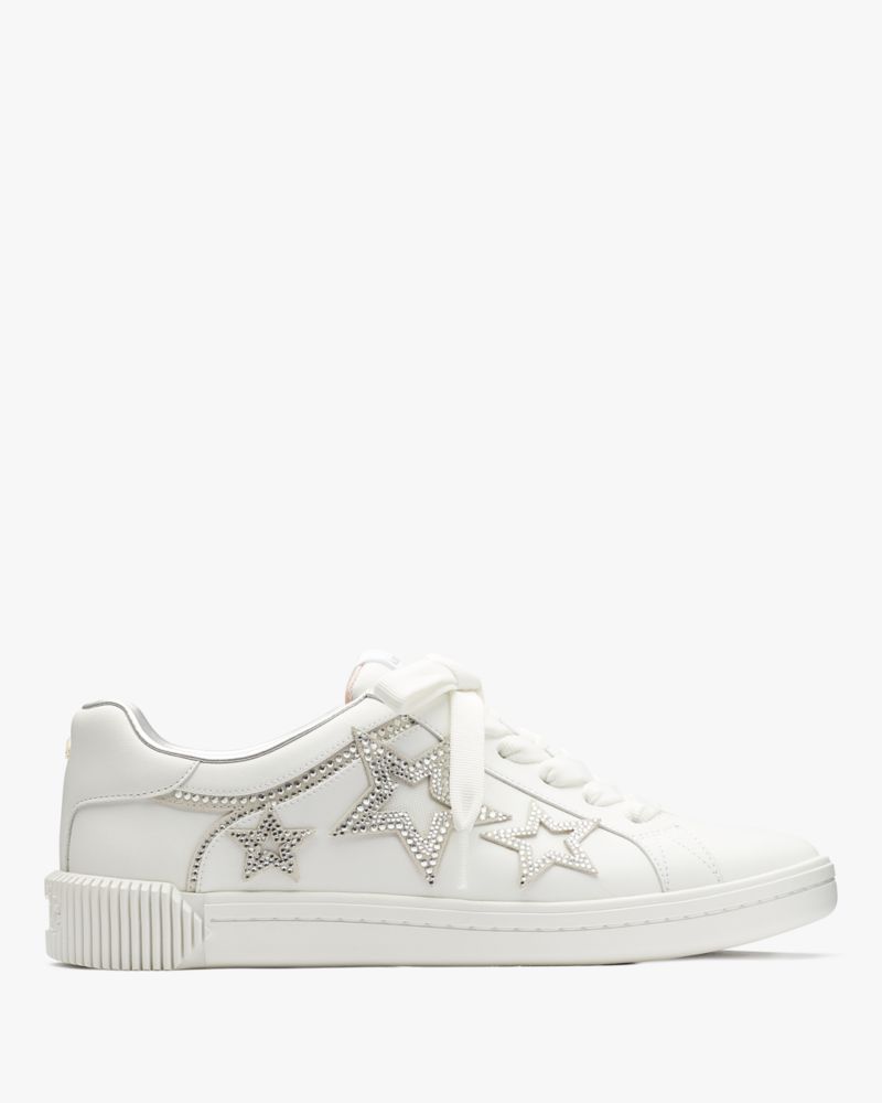 White trainers with outlet stars on them