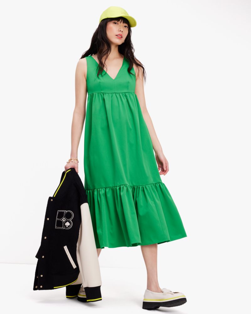 Green Floral Dress: a plus size summer outfit featuring a green floral dress  and wide fit straw hat from Torrid, and a dark green Kate Spade handbag.